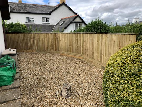 Curved feather edge fencing after photo