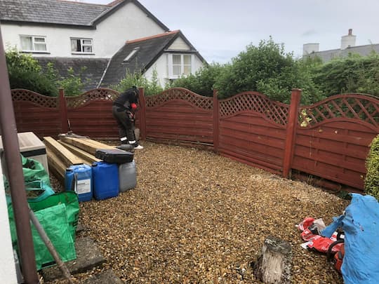 Curved feather edge fencing before photo