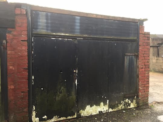 Large timber garage door before photo