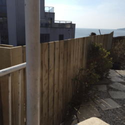 Back garden fencing overlooking the sea