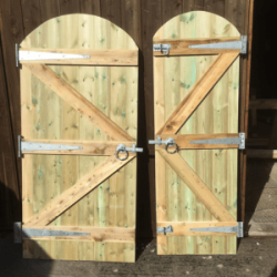 Back of single tongue and groove gates leaning against shed