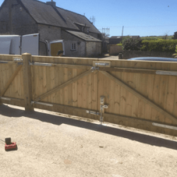 Drive view of double gates and gate walkway