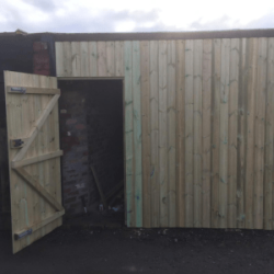 Large timber garage with door open