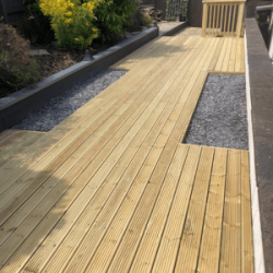 Long decking with two cut-out sections for plants