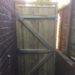 Tall and flat top single tongue and groove gate from back